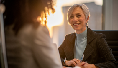 Manager with colleague smiling