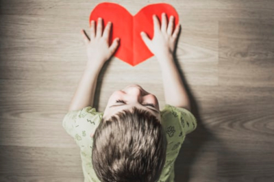 Child with paper heart