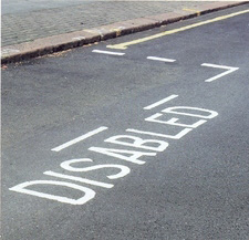 Disabled parking space painted on road