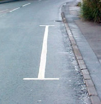 H marking painted on road