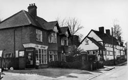 Black and white photo of Barston corner shop