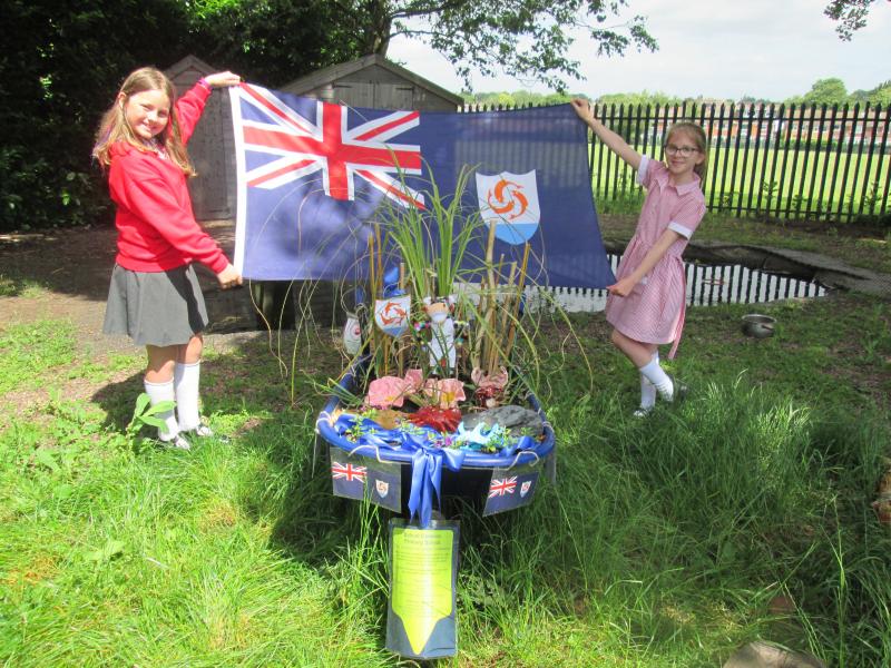 Students from Balsall Common Primary School with the Anguilla flag