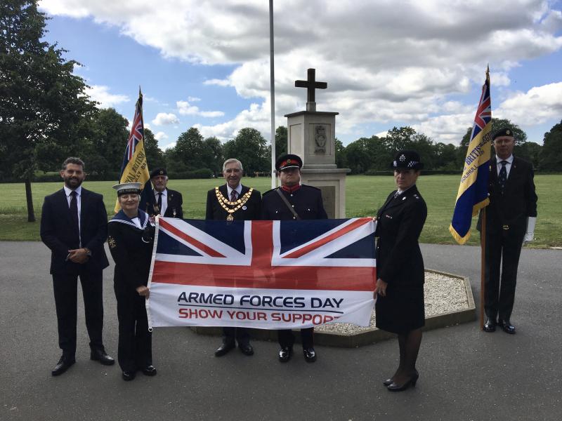 The Mayor of Solihull and others at the celebration holding the Armed Forces Flag.