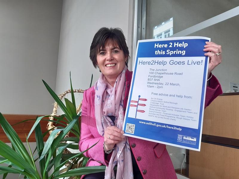 Cllr Karen Grinsell with a poster for the Here2Help this Spring events
