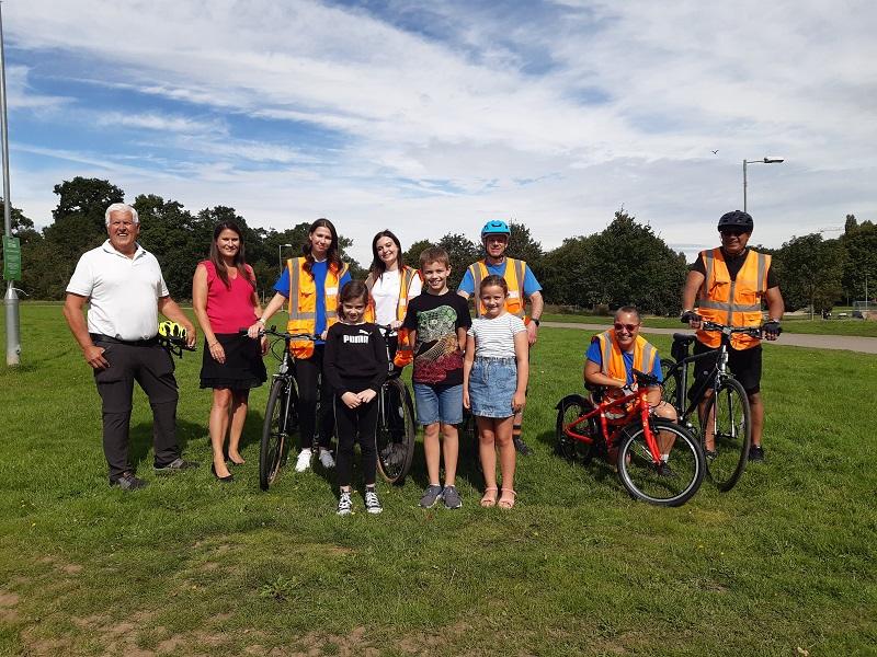 Cllr Hawkins, staff and local children at Tudor Grange Park
