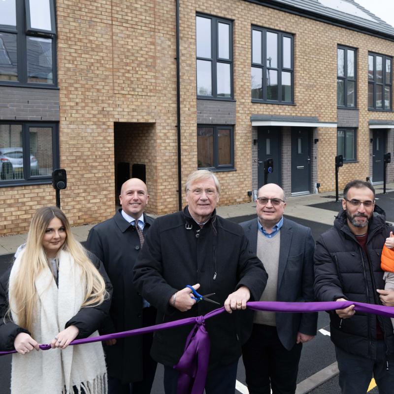 Cllr Mark Parker, Cllr Ian Courts and Cllr Andy Mackiewicz joined by Kinghurst residents outside the new Mountfort homes