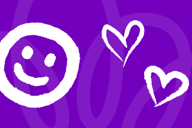 Chalk style drawing of smiley face on purple background
