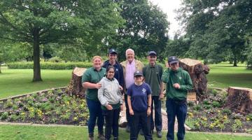 Newlands Bishops Farm students with Councillor Hawkins in front of flower bed