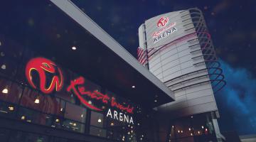 A picture of Resorts World Arena in Solihull, lit up at night