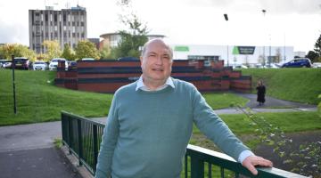 Cllr Andy Mackiewicz on the bridge over Kingshurst Brook in Chelmsley Wood