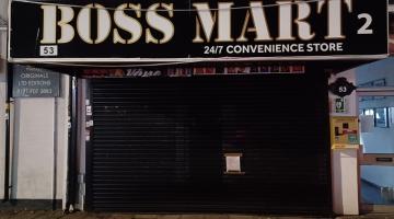 Photo of Boss Mart 2 with closure order attached to shutters