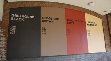 A graphic displaying four colours of The Solihull Colour Palette displayed on the wall of Touchwood