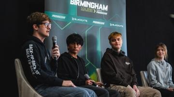 Four esports students on the stage hosting the student panel at the esports business and innovation summit 