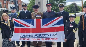 The Mayor and Royal British Legion Shirley hold the armed forces day flag