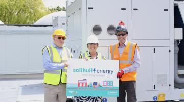 Cllr Andy Mackiewicz (Cabinet Member for Climate Change and Planning), Councillor Karen Grinsell (Leader of Solihull Council) and Dave Pardoe, Contracts Manager (Vital Energi) stood in front on the recently installed Air Source Heat Pumps
