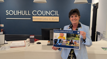 Cllr Karen Grinsell, Leader of Solihull Council - with the Council Plan.