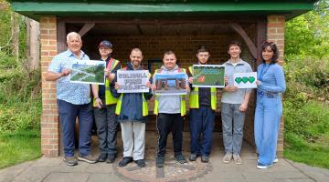 Newlands Bishop Farm service users stood next to Cllr Ken Hawkins at Malvern and Brueton Parks