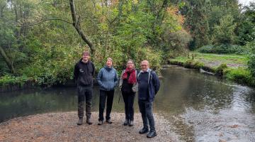 Councillor and workers outside river works in Brueton Park
