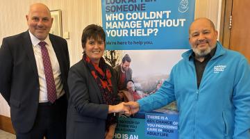 Councillors shake hands with Chief Executive, Carers Trust Solihull