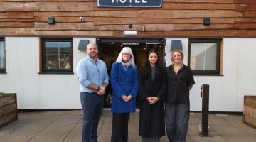 Tom, Cllr Delaney, Abi and Ruth standing in front of the Barn Hotel