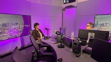 cllr grinsell sits in the BBC WM studio across the desk from host Ed James