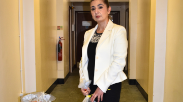 Cllr Wazma Qais with some of the counterfeit clothes