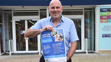 Cllr Tony Dicicco with a poster for Later Life