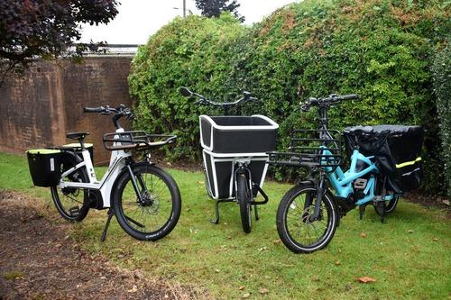 An image of three e-cargo bikes