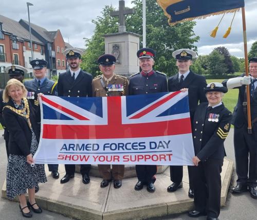 The Mayor and Royal British Legion Shirley hold the armed forces day flag