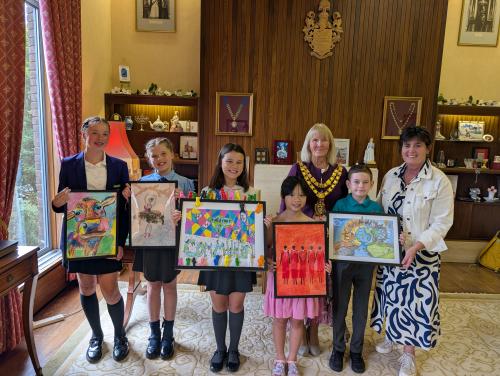 Mayor of Solihull and Leader of Solihull Council with artwork winner and runners up from Solihull schools.