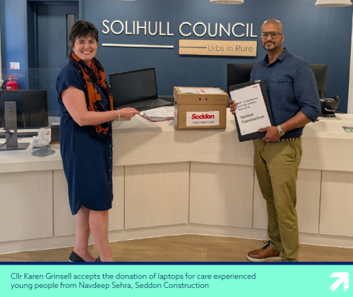 photo of Cllr Karen Grinsell accepts the donation of laptops for care experienced young people from Navdeep Sehra, Seddon Construction