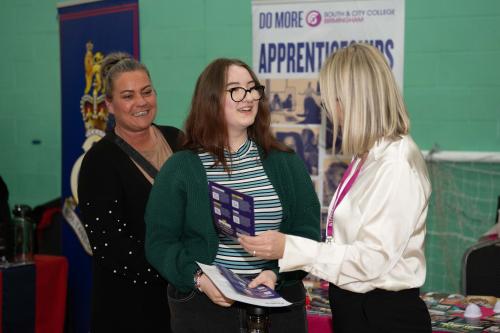 A student and a parent asking exhibitors questions at the previous show.
