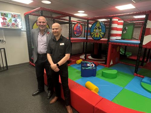 Cllr Dicicco and James Forsyth standing in front of the soft play area at North Solihull Sports Centre