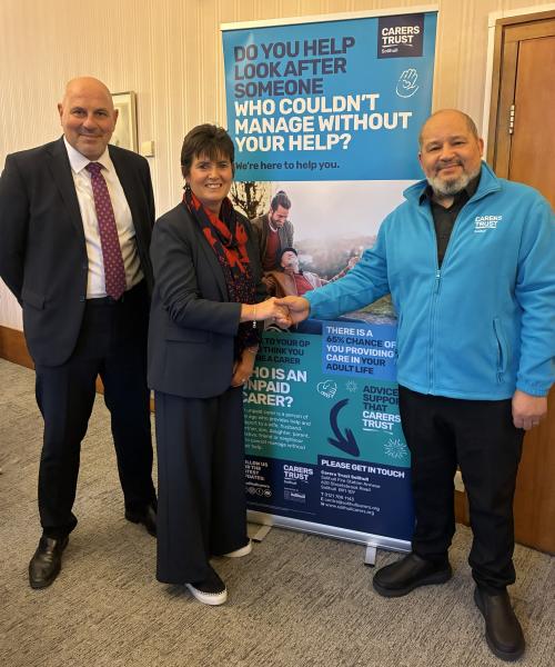 Councillors shake hands with Chief Executive, Carers Trust Solihull