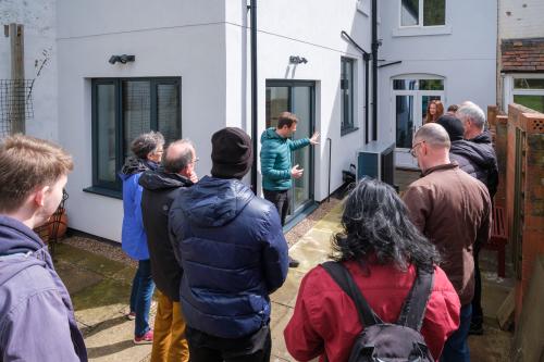 The Green Doors team taking a small group on a tour of a retrofitted home in south Birmingham