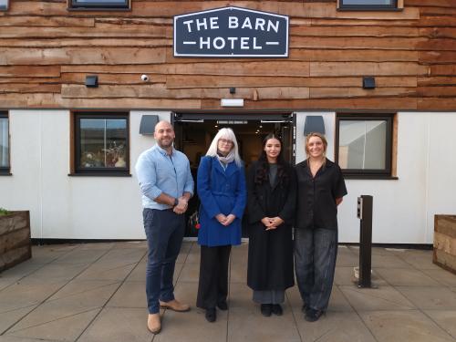 Tom, Cllr Delaney, Abi and Ruth standing in front of the Barn Hotel