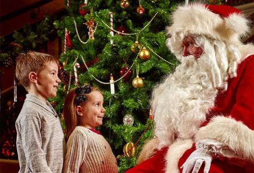 Children looking at Santa Claus