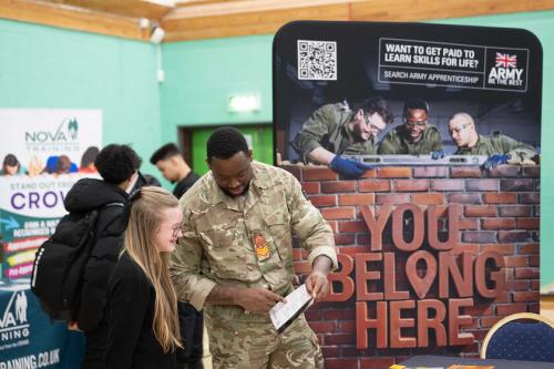a young person talking with an exhibitor at the Solihull Apprenticeship and Pathways Show
