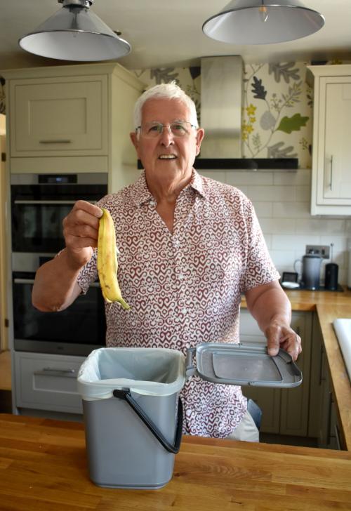 Cllr Ken Hawkins with the new food kitchen caddy