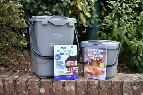 Food caddies next to leaflets