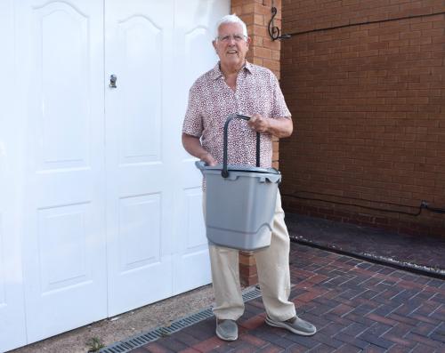 Cllr Ken Hawkins with the outdoor food caddy