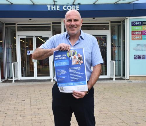 Cllr Tony Dicicco with a poster for Later Life